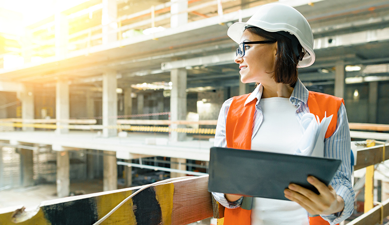 Construction worker with tablet.